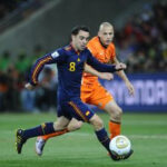 Xavi in action for Spain against Netherlands in the 2010 World Cup final.
