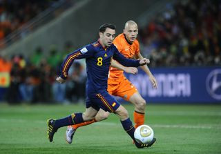 Xavi in action for Spain against Netherlands in the 2010 World Cup final.