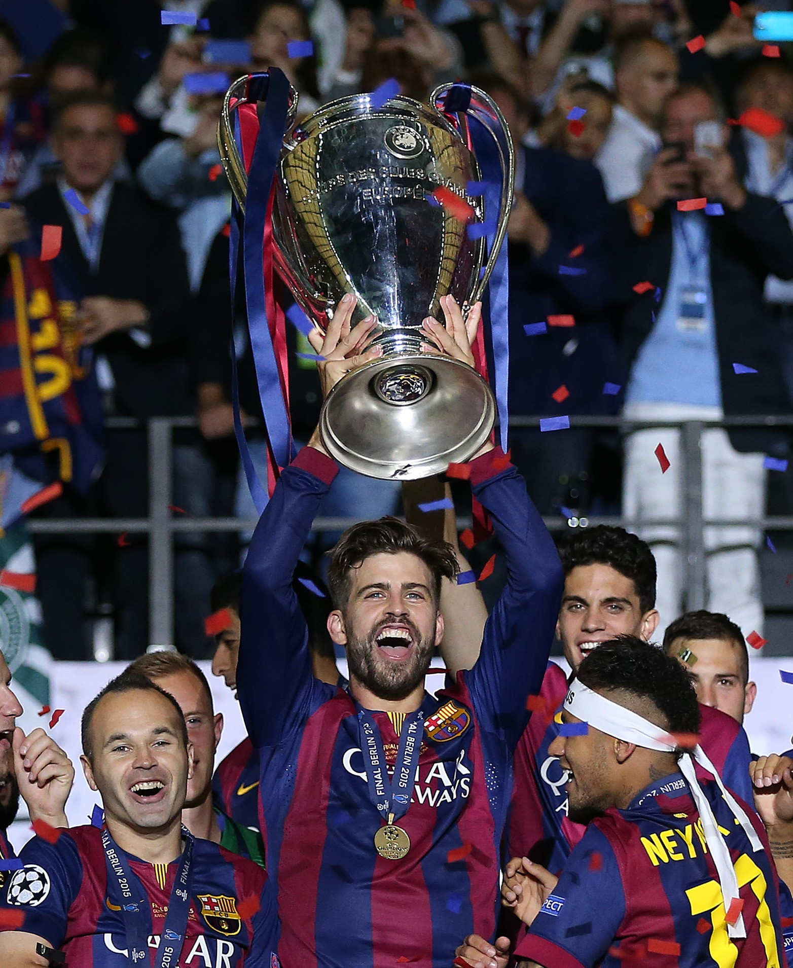 Gerard Pique lifting a trophy with FC Barcelona