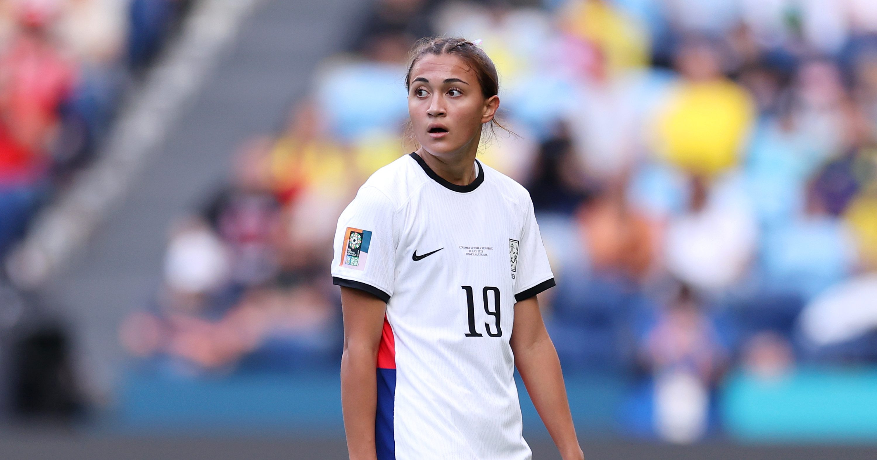 Soccer player scoring an own goal