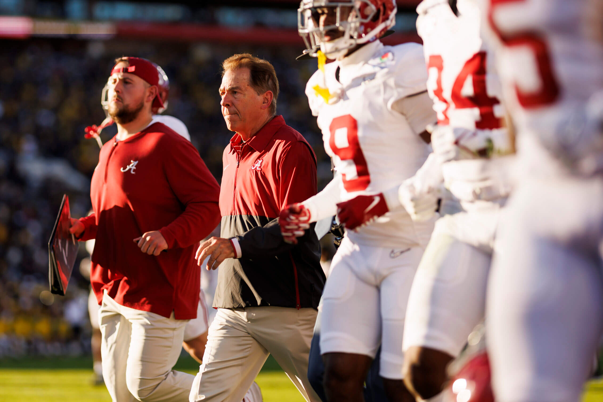 Saban runs out with team ahead of CFP semifinal against Michigan. (Photo: Ryan Kang / Getty Images)