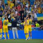Ukrainian football fans holding a banner