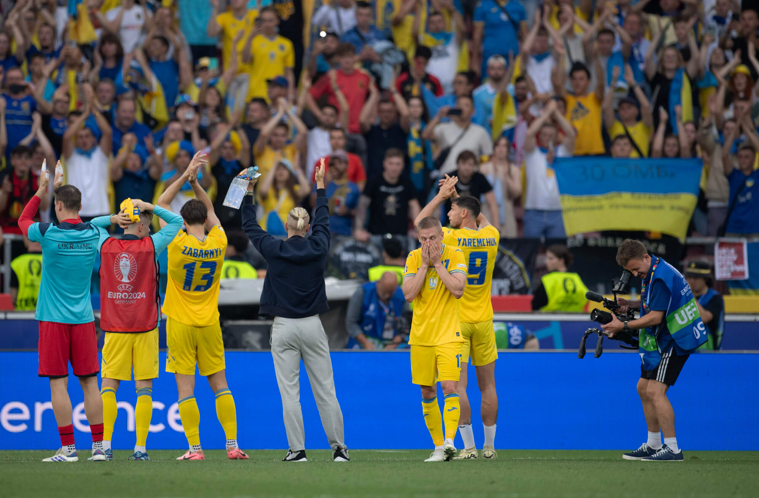 Ukrainian football fans holding a banner
