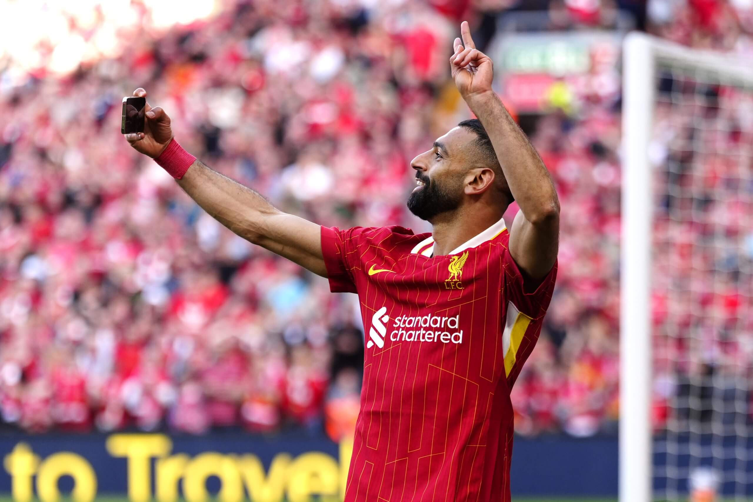 Mohamed Salah celebrating his second Premier League title with a goal against Tottenham Hotspur on Sunday – and a selfie