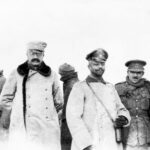 British and German officers meeting on December 25, 1914, showcasing the Christmas Truce and the effort to meet between enemy lines