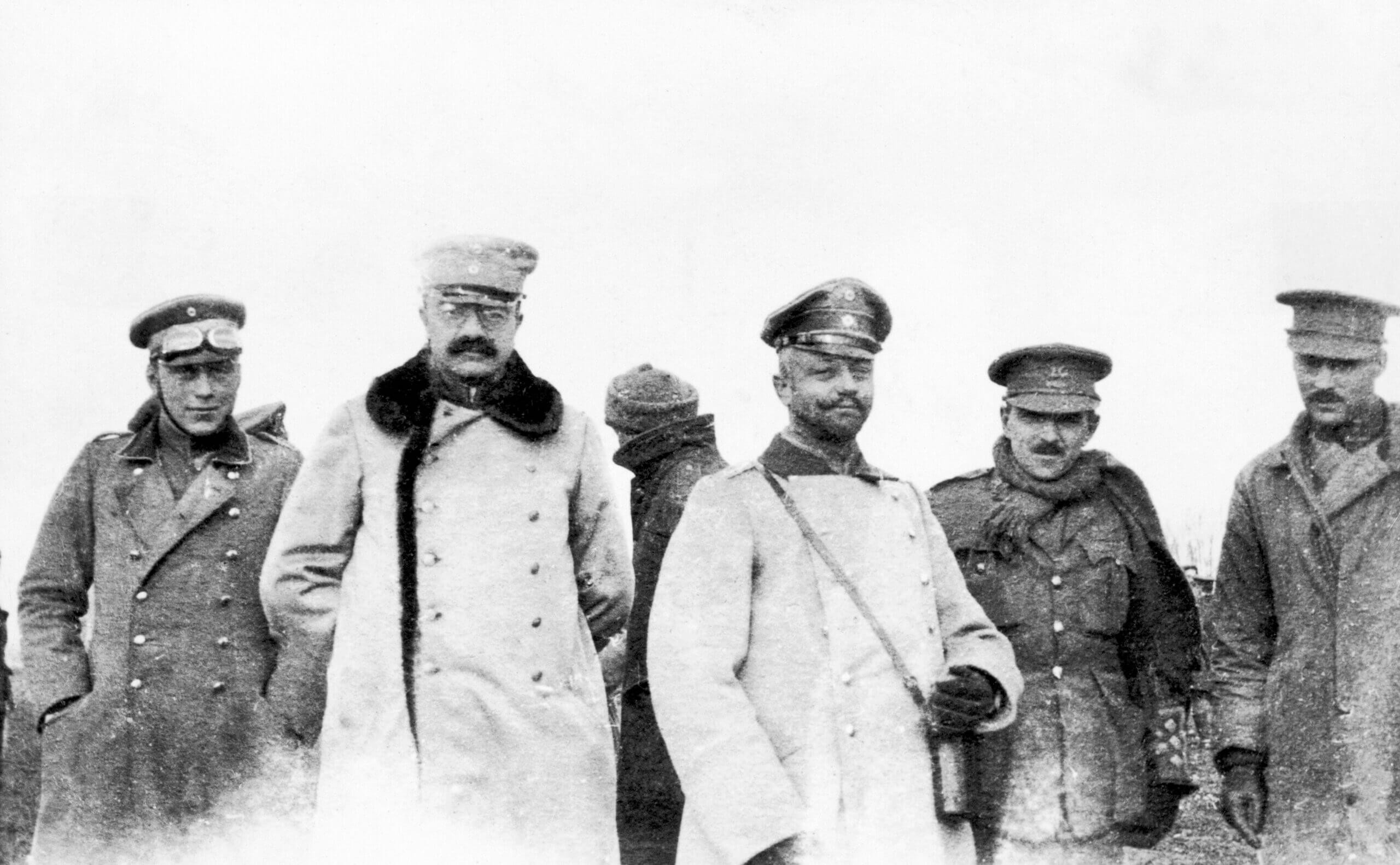 British and German officers meeting on December 25, 1914, showcasing the Christmas Truce and the effort to meet between enemy lines