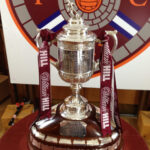 Hearts Scottish Cup trophy draped in maroon colors