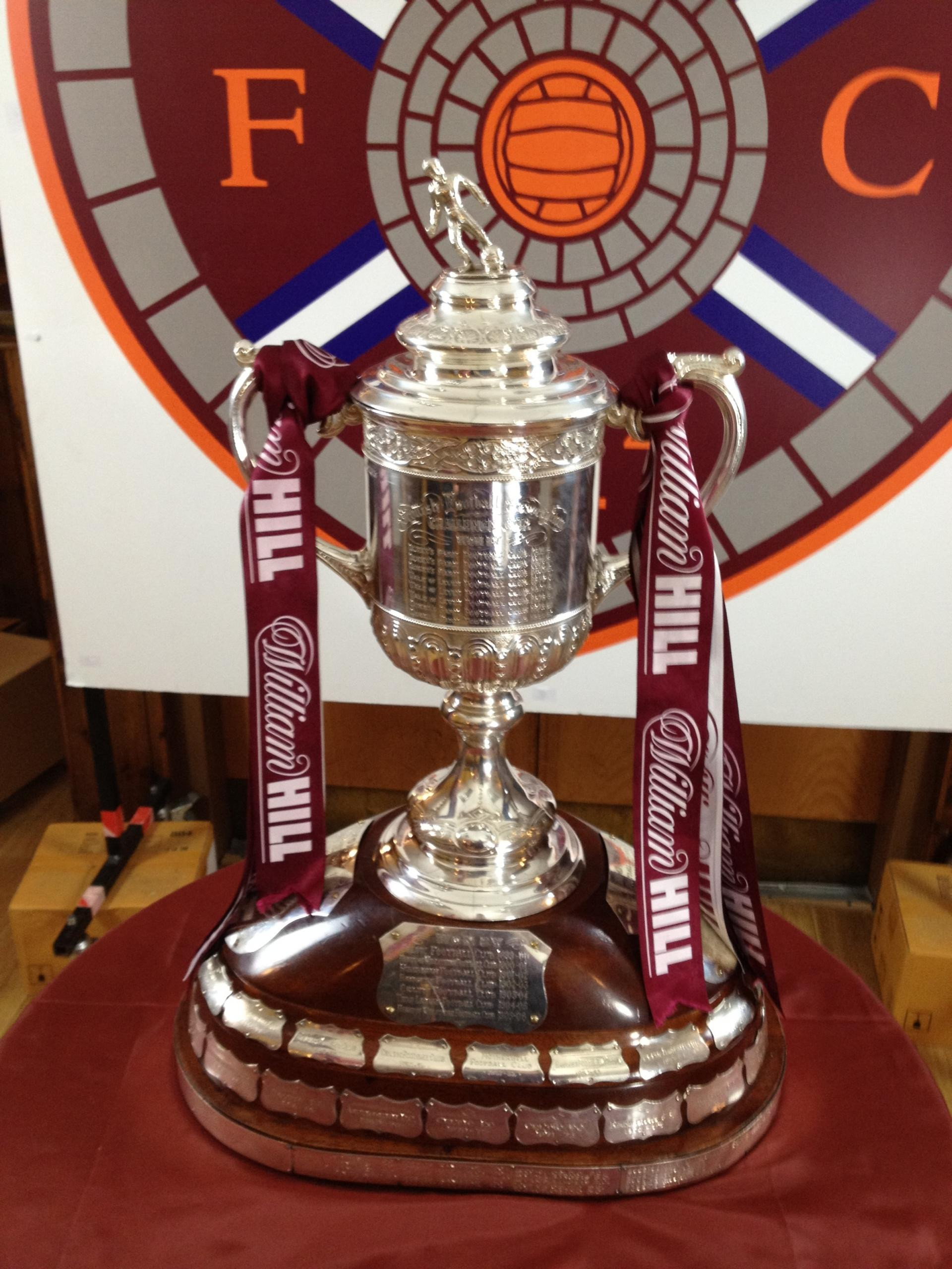 Hearts Scottish Cup trophy draped in maroon colors