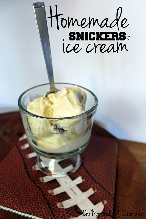 a glass cup of snickers ice cream with large chunks of chocolate visible