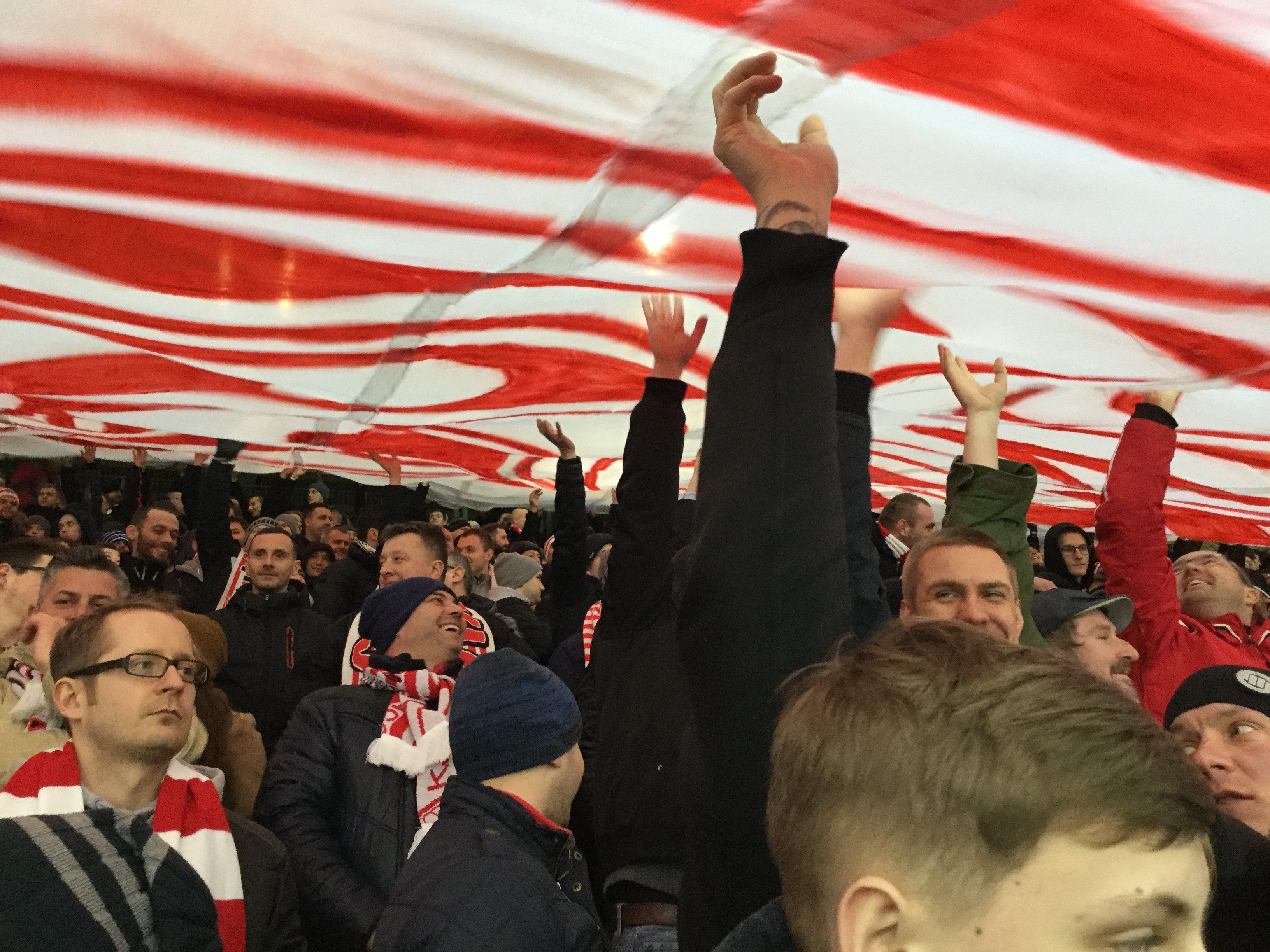 Fans celebrating at a Cracovia game