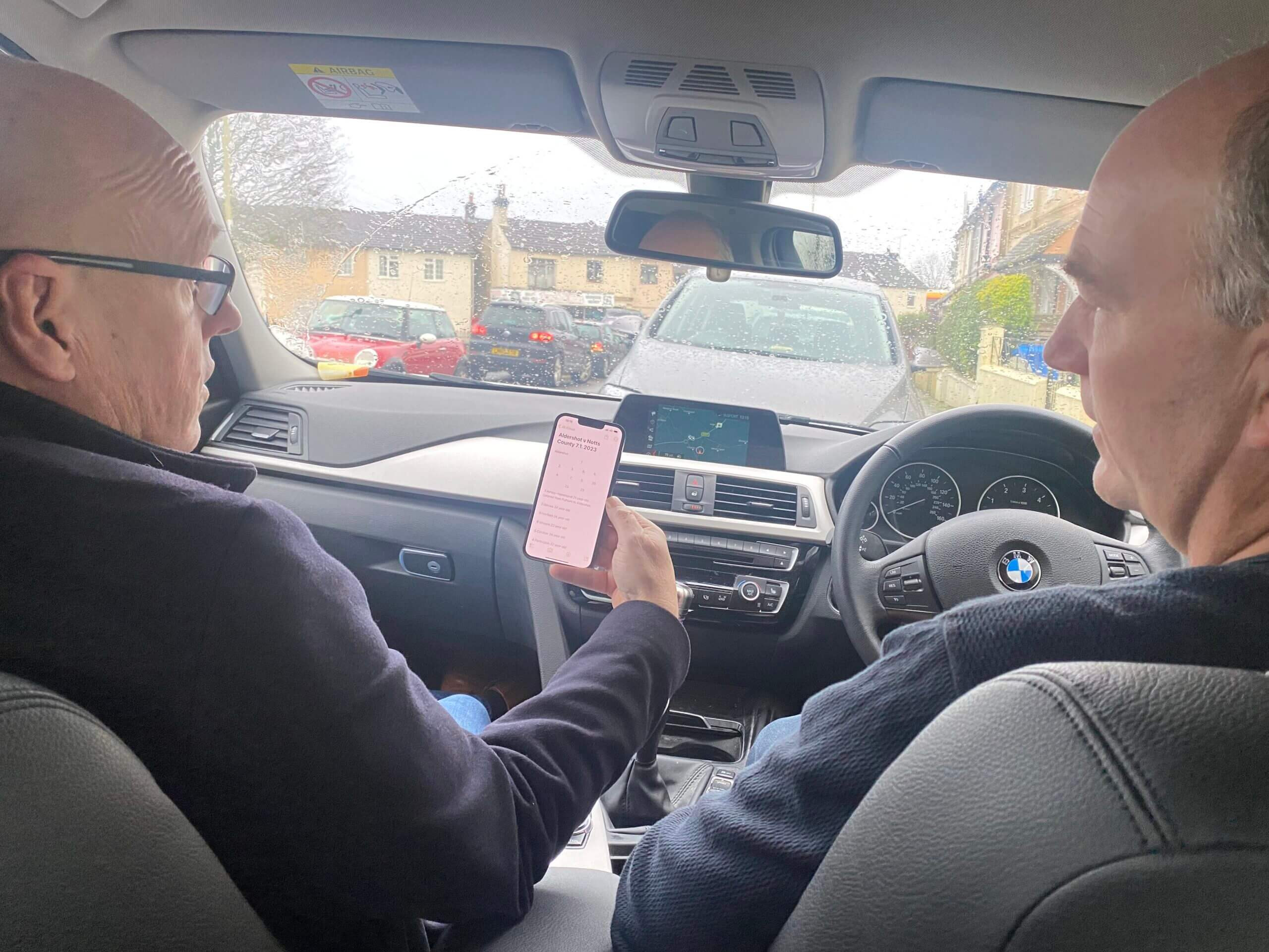 Brian McDermott (left) shares ideas with Nick Baggott before their scouting assignment at Aldershot