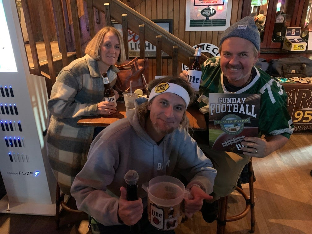 People Watching Football at a Bar