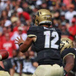 center-is-preparing-to-hike-the-ball-to-the-quarterback-during-a-football-game