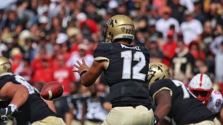 center-is-preparing-to-hike-the-ball-to-the-quarterback-during-a-football-game