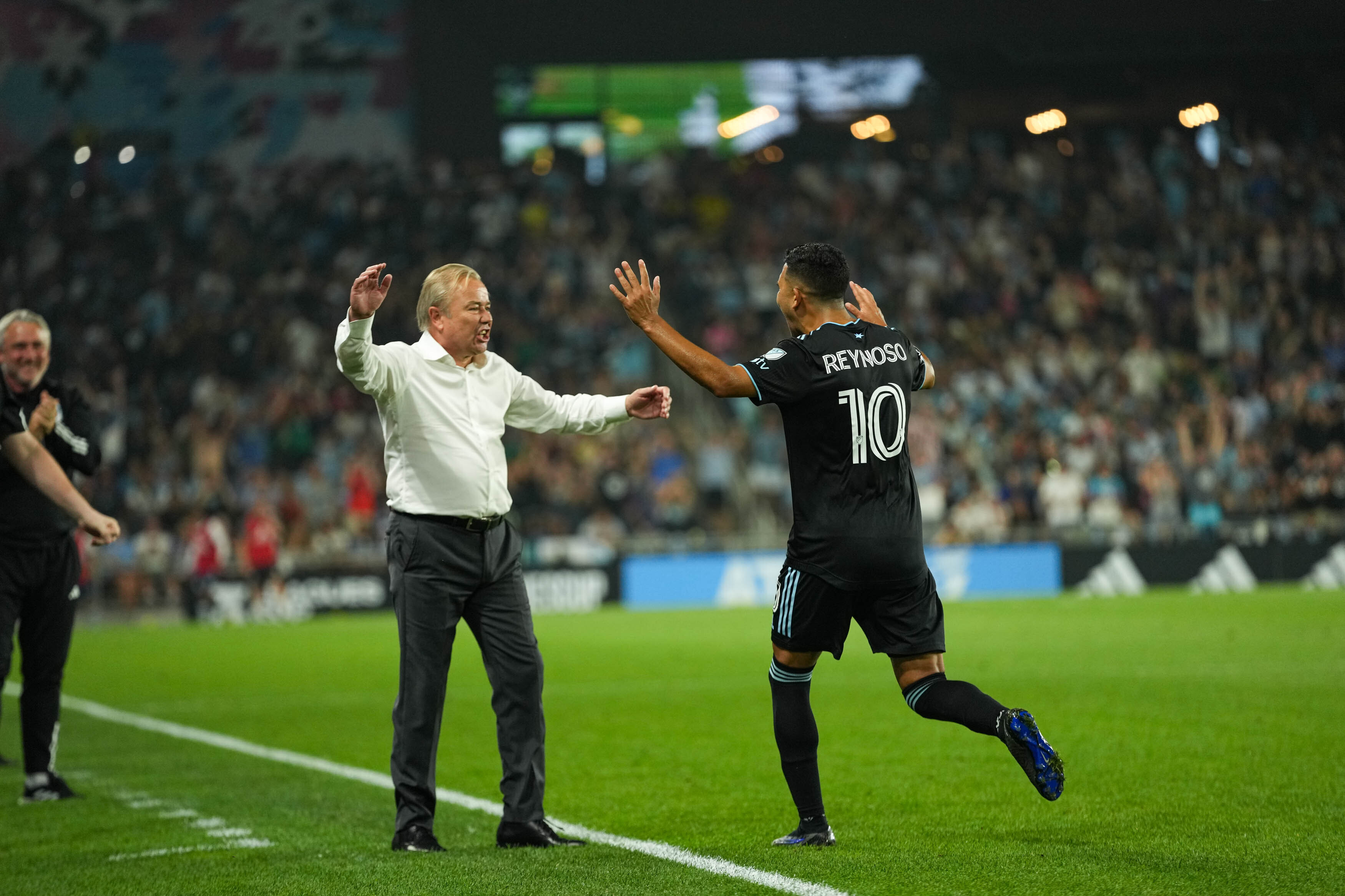 Minnesota United manager Adrian Heath, left, celebrates with Emanuel Reynoso after Reynoso's free-kick goal against Puebla in a Leagues Cup match at Allianz Field on July 23, 2023. Courtesy of Minnesota United