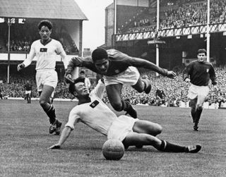 Portugal's Eusebio wins a penalty against North Korea