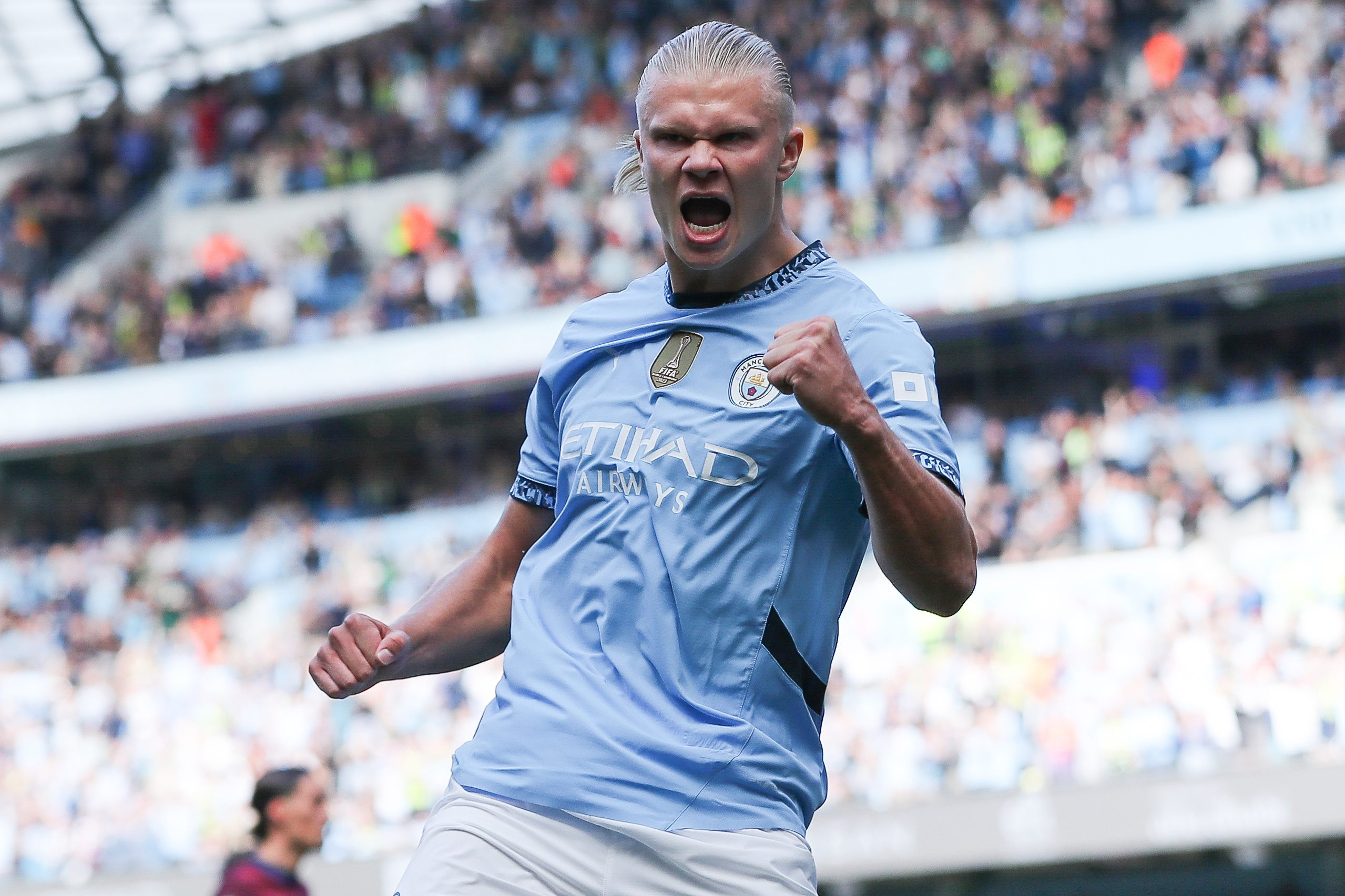 Erling Haaland celebrates a goal for Man City