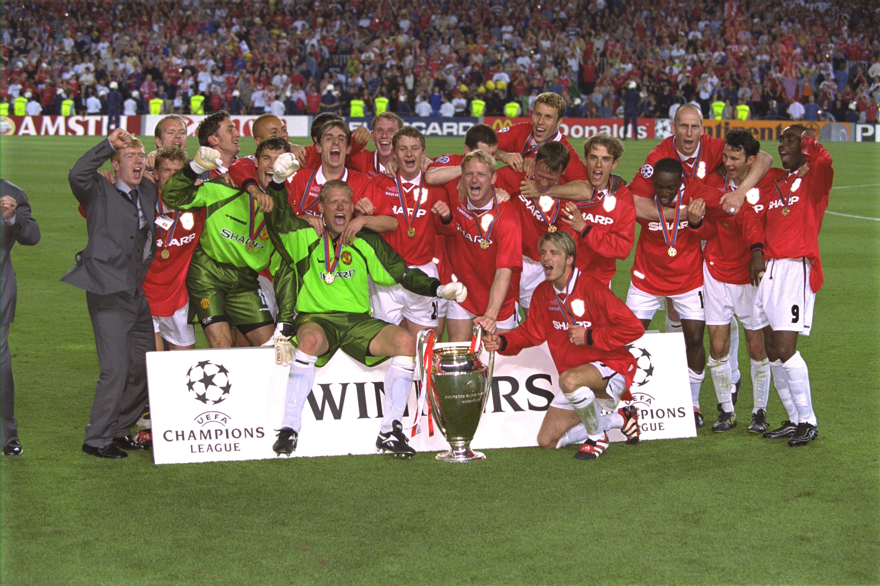 Manchester United celebrating their treble win in 1999
