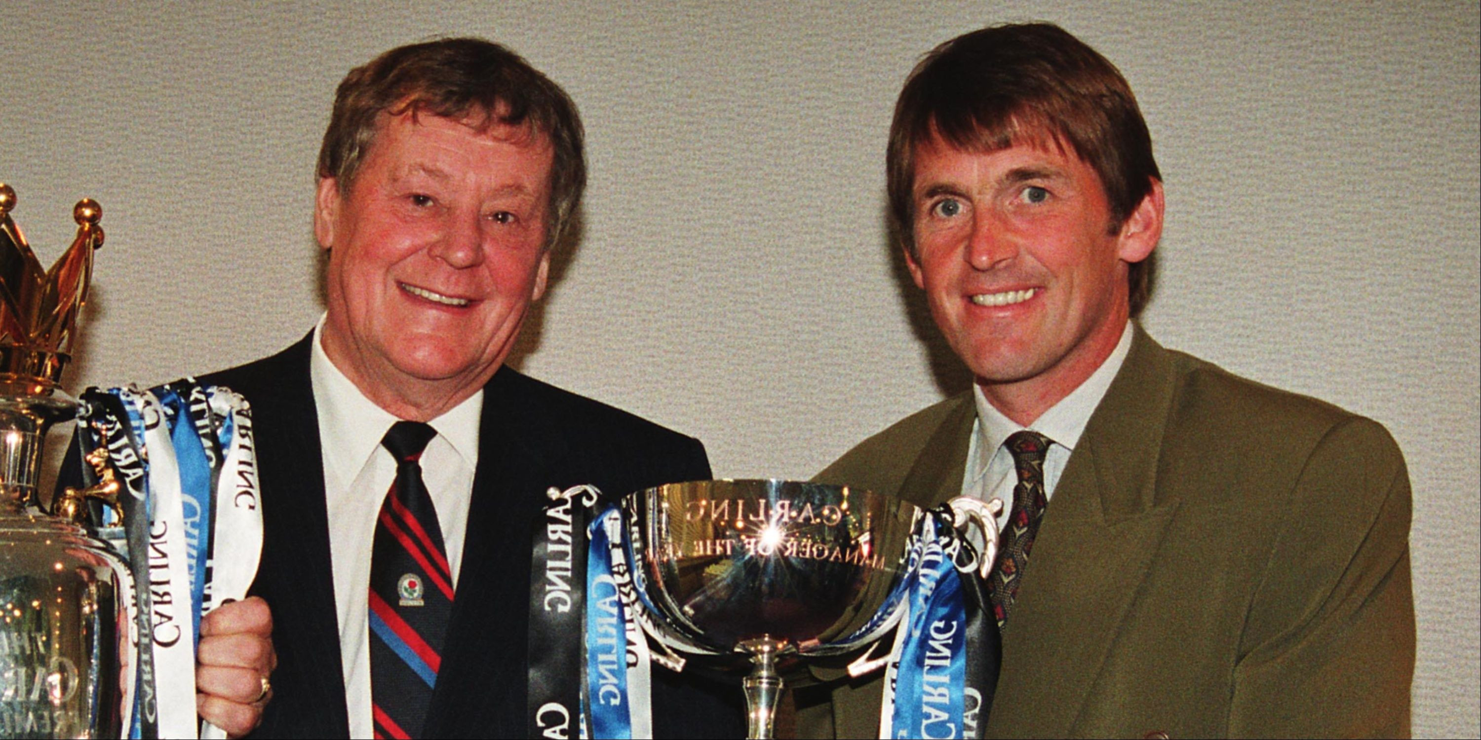 Kenny Dalglish holding a trophy