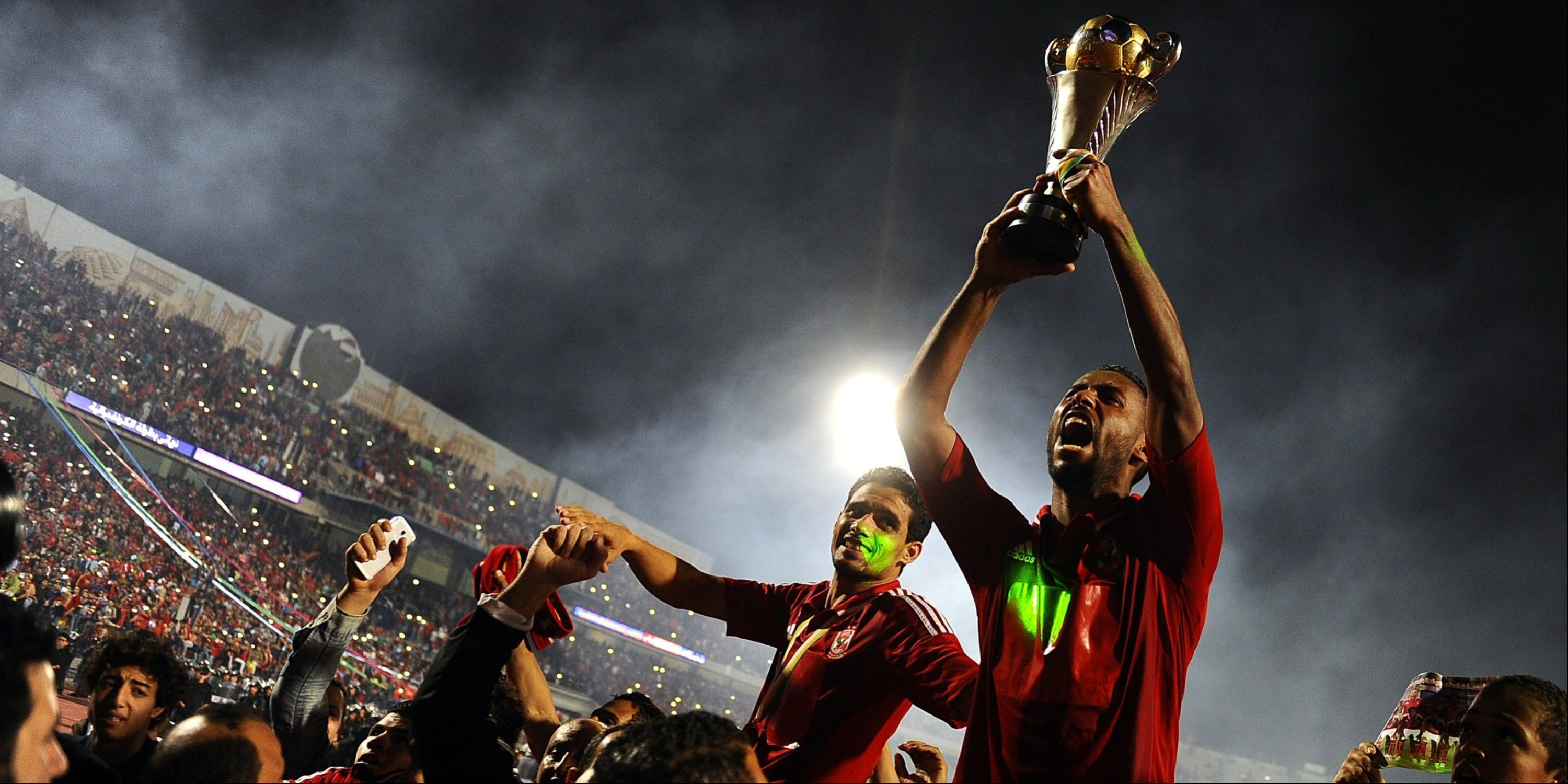 Hossam Ashour lifting a trophy