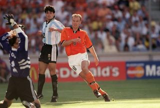 Dennis Bergkamp scores against Argentina in 1998