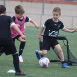 Football camp drills focusing on agility and speed, essential components for enhancing players' quickness and coordination