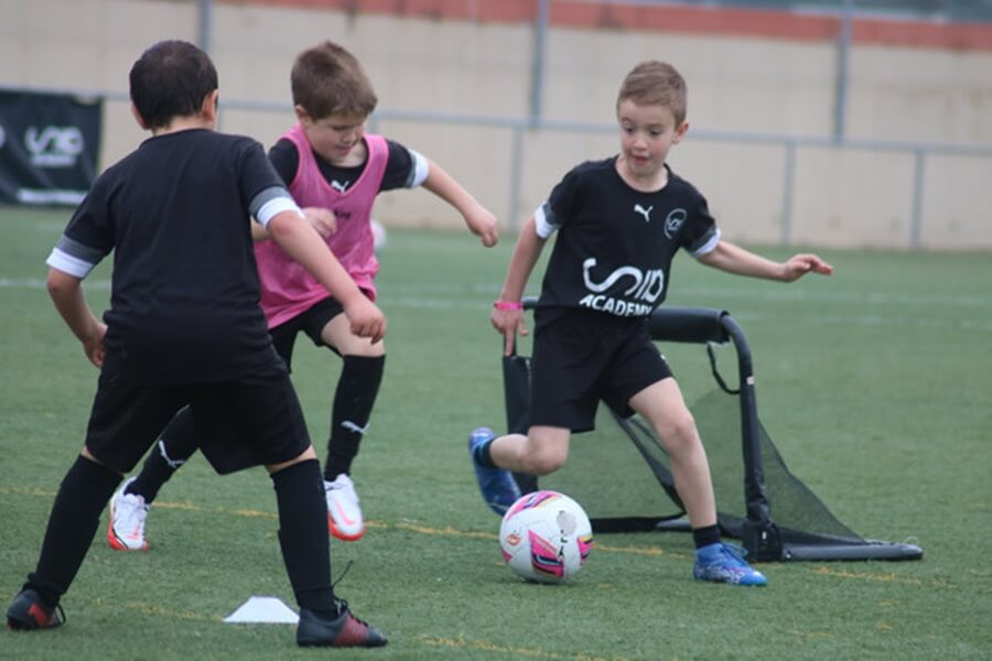 Football camp drills focusing on agility and speed, essential components for enhancing players' quickness and coordination