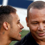 Neymar Jr. and Neymar. Sr. enjoy a chin wag as they watch Neymar Jr.