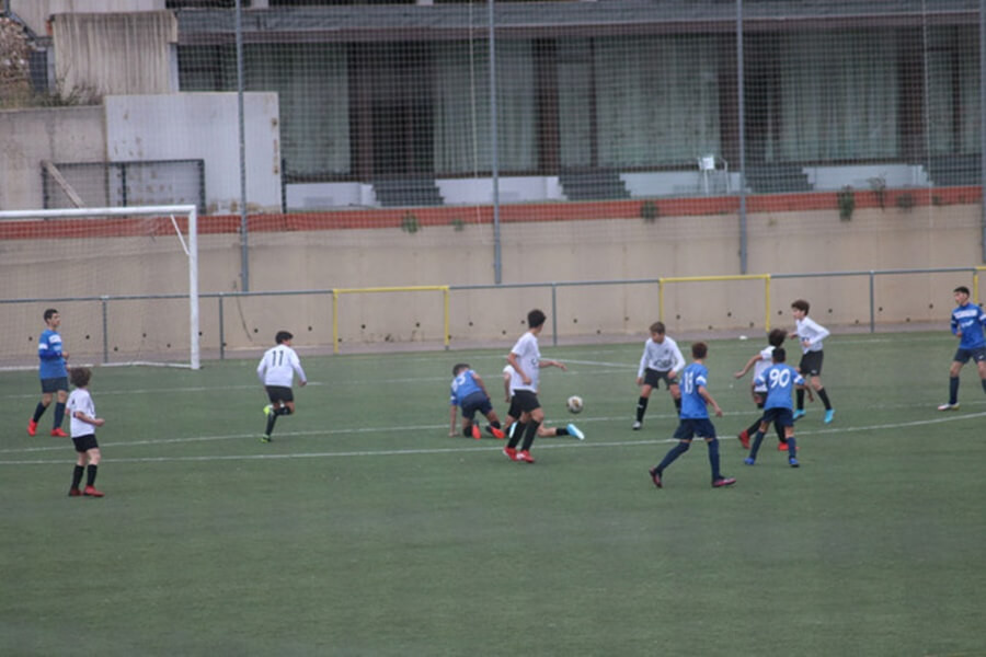 Game scenario during football camp, emphasizing practical application of skills and strategic thinking