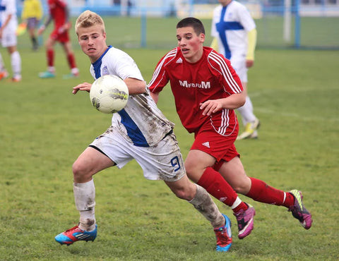 Football player breathing deeply during training