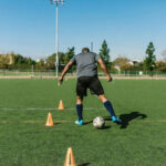 Basic Cone Weave: Dribble the ball through a line of cones, alternating feet.