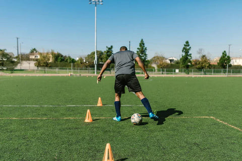 Basic Cone Weave: Dribble the ball through a line of cones, alternating feet.