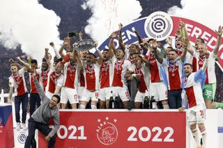 Ajax players celebrate after their Eredivisie win