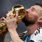 Lionel Messi with the World Cup trophy