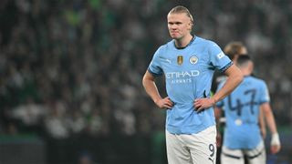 Manchester City’s Erling Haaland stands with his hands on his hips during his team’s Champions League defeat to Sporting Clube de Portugal.
