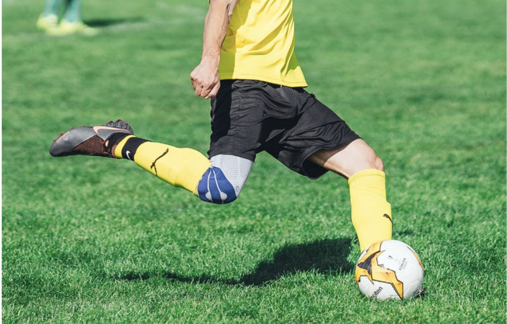 Soccer Player Controlling Ball with Foot