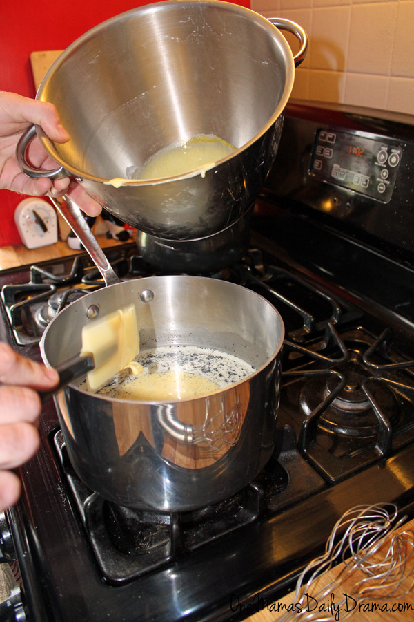 tempering the ice cream mixture in a stainless steel saucepan
