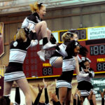 Cheerleaders performing a stunt
