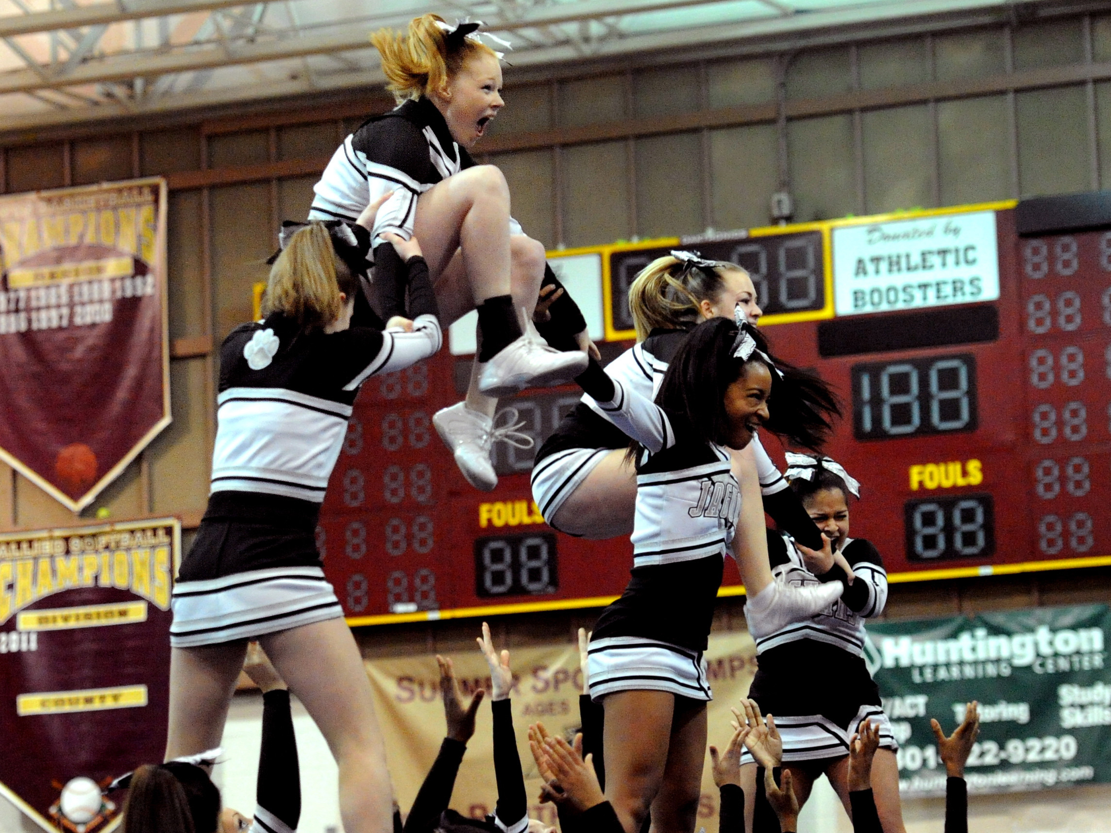 Cheerleaders performing a stunt