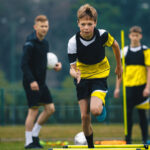 Football player sprinting on the field