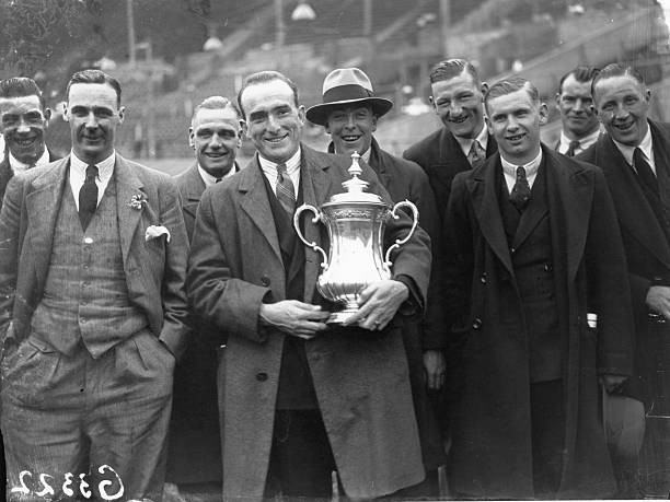 Arsenal players celebrating their FA Cup victory in 1930