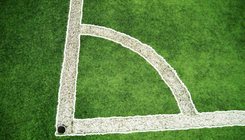 The corner markings and flags provide a 3 dimensional visual cue on the length and width of a football pitch