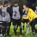 Coaches giving instructions to young players at a UEFA Pro License exchange