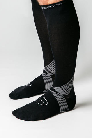 A football player showcasing the stability and control gained from wearing grip socks