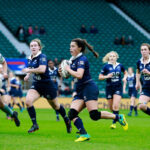Sophie Trott, an Oxford Rugby player, showcases her running prowess during a Varsity Match, supported by her teammates