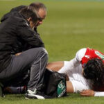 Radamel Falcao receives treatment after suffering a serious knee injury in action for Monaco against Chasselay in January 2014.