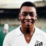 Smiling young Pelé posing for a colour picture in Santos FC jersey