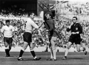 Dave Mackay of Tottenham Hotspur confronts Billy Bremner of Leeds during their First Division Football match at White Hart Lane. 29th August 1966. Pic via Mirrorpix.