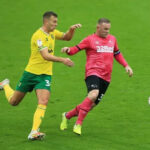 Ben Gibson battling with Wayne Rooney