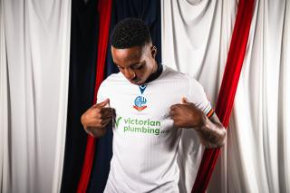 Victor Adeboyejo wearing Bolton Wanderers 2024/25 home kit